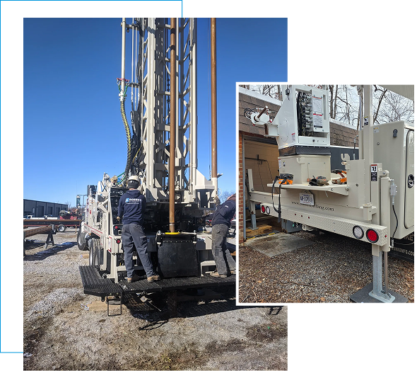 A large drilling machine at a construction site under clear blue sky.